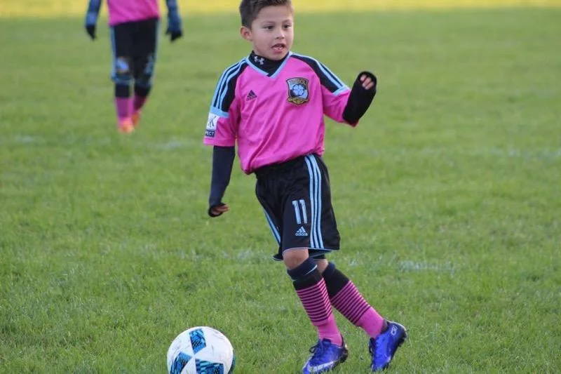 JJ playing soccer after treatment for perthes disease