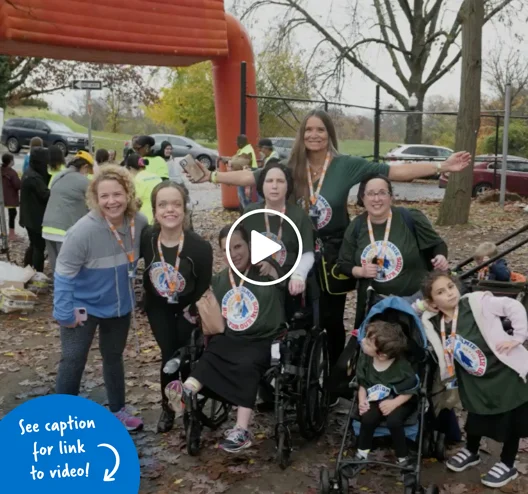 Pediatric Liaison Marilyn Richardson with patients and family members celebrating at the finsh line of the Family Fun Walk