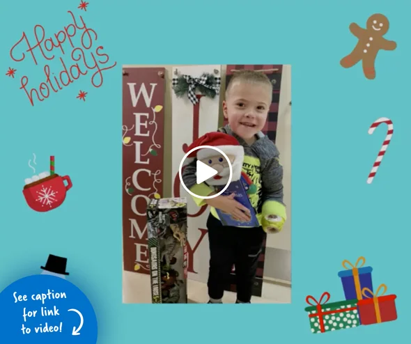 A young boy with toys he picked as a holiday gift