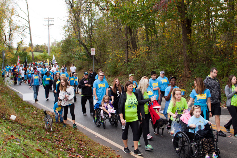 Families, patients walking and in wheelchairs and other participants walking during the family fun walk at Rubin Institute for Advanced Orthopedics 2017 Save-A-Limb Fund Event