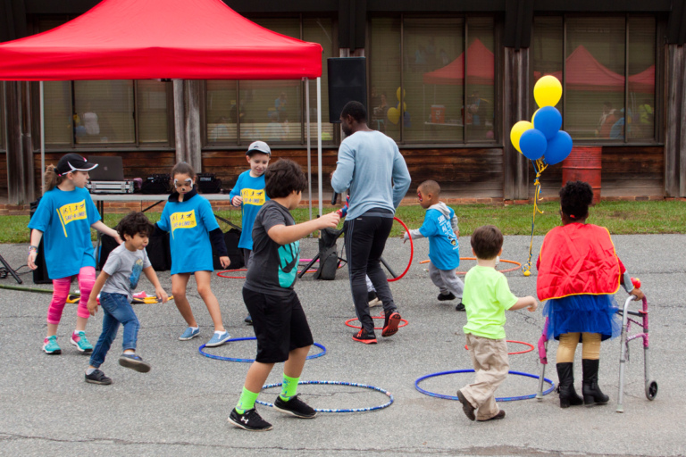 Young children play with hula hoops at Rubin Institute for Advanced Orthopedics 2017 Save-A-Limb Fund Event