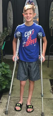 Jeffrey at 11 with internal fixation and crutches
