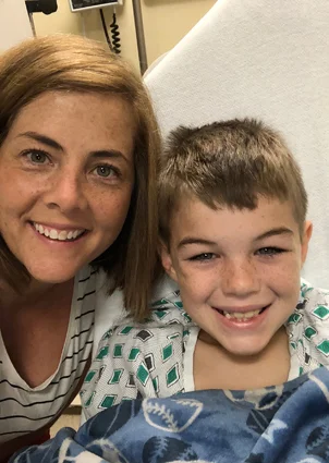 Preston and his mom smiling at the hospital