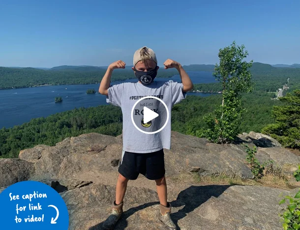 Jadon in a power pose at the top of Rocky Mountain