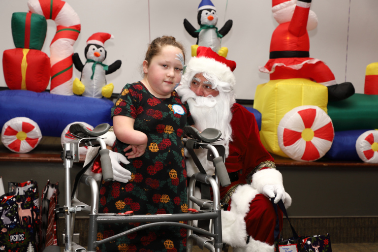 Young girl with a walker with Santa