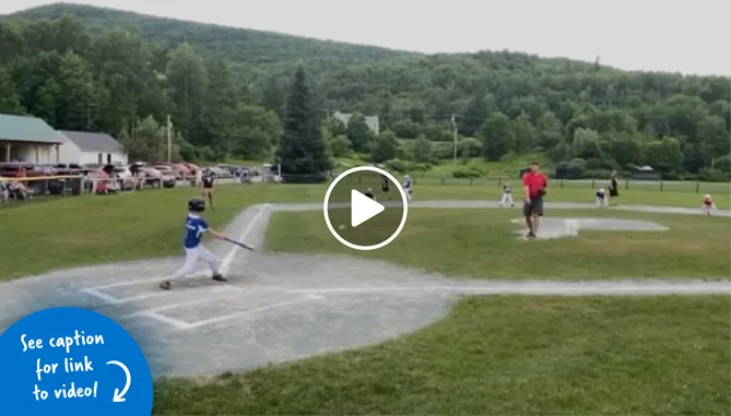 Kids playing baseball on a field