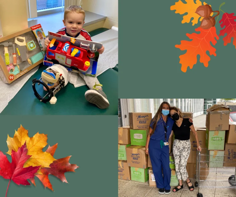 Brenda Holt standing with Marilyn Richardson and boxes of toys that she has donated, and a boy with an external fixator on his leg holding one of the toys