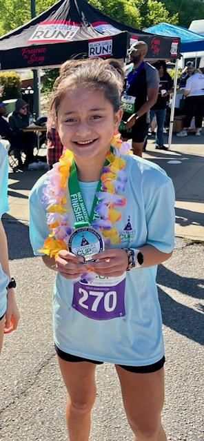 Aria with a finishing medal from a race
