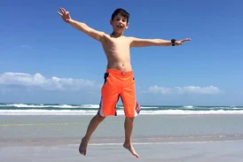 Jackson jumping up high on the beach