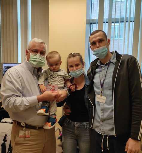 Kacper with his mother, father, and Dr. Shawn Standard after his first ulnarization surgery for club hand