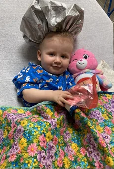 Lara awaiting surgery with stuffed animal